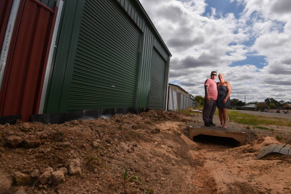 Mark and Kylie Ware, who have experienced three or four flooding episodes in the three years they have been in their Midland Highway property. Picture by Darren Howe