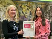 Bendigo's Emily Griffin receives the Early Career Pharmacist of the Year award from Pharmaceutical Society of Australia Victoria president Amy Page. Picture supplied