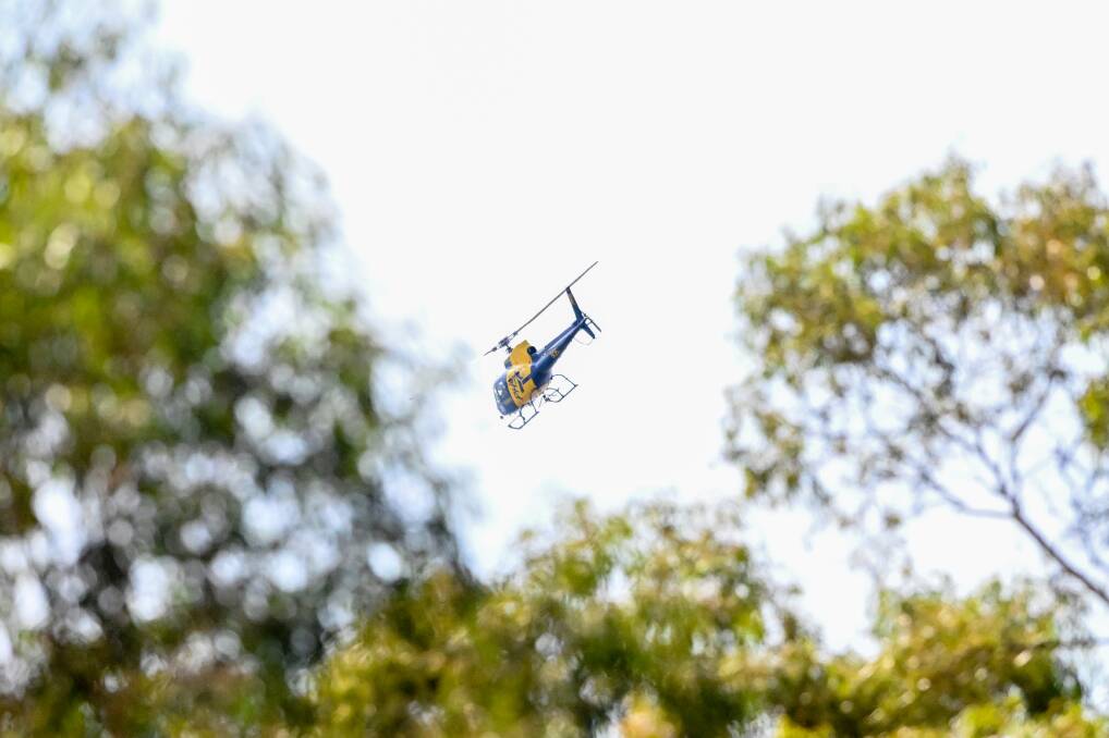 Air support was called in to extinguish the One Tree Hill fire. Picture by Darren Howe.