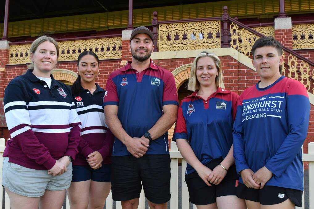 Sandhurst players Sarah Baldwin, Ruby Campbell, Lily Campbell and Amanda Carrod with new coach Andrew Saladino at the QEO. Picture by Adam Bourke