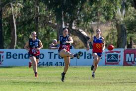 Sandhurst captain Ruby Campbell kicks inside 50 during the Dragons maiden CVFLW win. Picture by Enzo Tomasiello