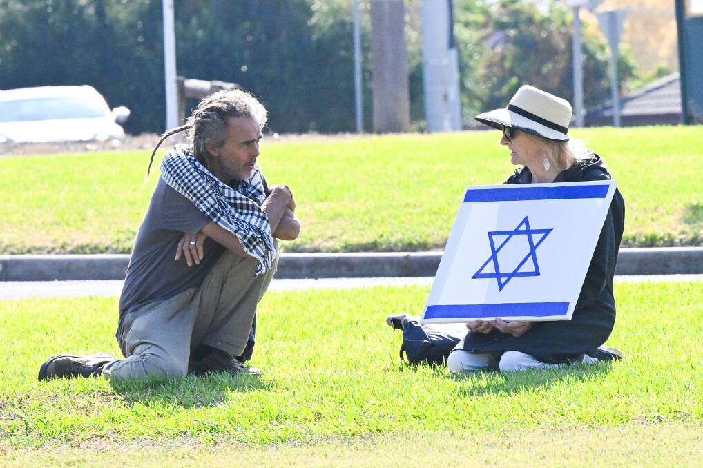 At least one person with an Israeli flag attended the protest. Picture by Darren Howe.