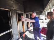 CFA Chief Officer Jason Heffernan shows how trainees will see investigate the training rooms. Picture by Darren Howe