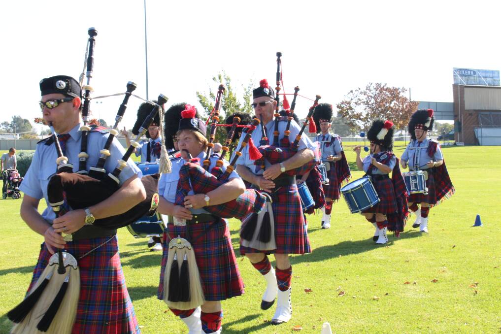 Members of the Bendigo Highland Pipe Band putting on their latest show in Canterbury Gardens on Saturday.