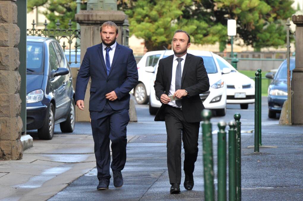 Joby Anthony Rowe (left) arrives at the Supreme Court in Bendigo for his child homicide trial with lawyer, Alex McLennan. Picture: NONI HYETT