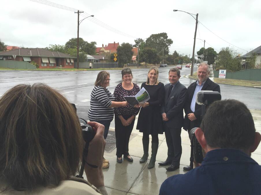 Residents Margaret Jones and Maxine Anderson, Jacinta Allan and VicRoads' David Runnalls and Jim Forge after the release of a report on the upgrade in April.