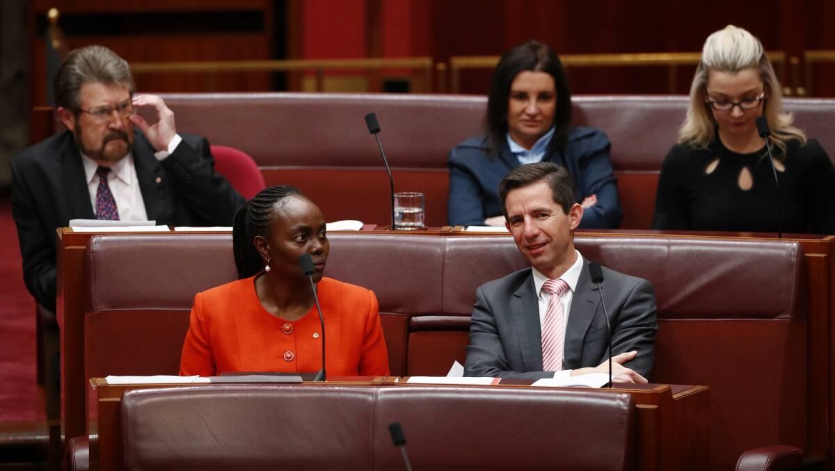 Federal Education Minister Simon Birmingham during discussions with crossbench senators Derryn Hinch, Lucy Gichuhi, Jacqui Lambie and Skye Kakoschke-Moore in the Senate on Wednesday. Picture: ALEX ELLINGHAUSEN