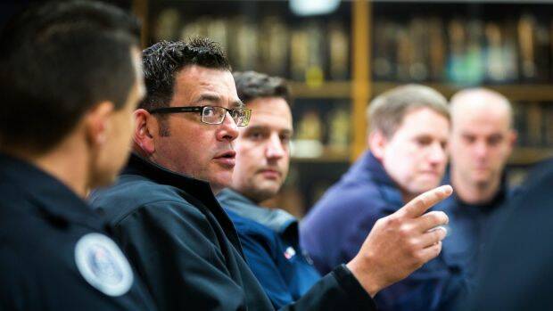 Premier Daniel Andrews with volunteer and staff firefighters at the Springvale CFA station. Photo: CHRIS HOPKINS