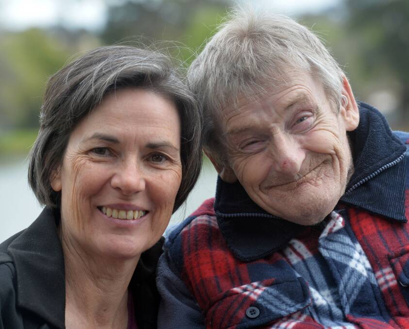 Listening: Mary Sullivan with Scope client Graeme Payne at Lake Weeroona last year. Picture: BRENDAN McCARTHY