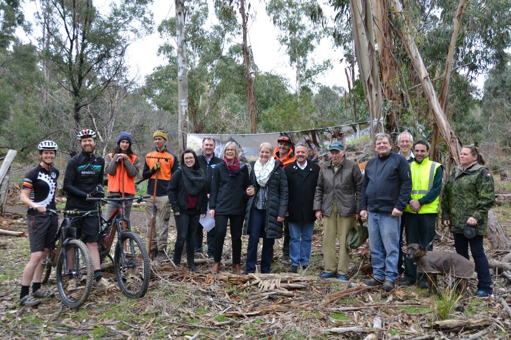 Under way: Bendigo West MP Maree Edwards joins supporters of the planned Harcourt mountain bike park as construction begins on Thursday. Picture: CONTRIBUTED