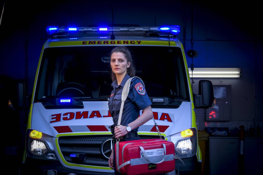 Paramedic Charlotte Paton was almost hit by a semi-trailer while treating someone on the side of the road.  Picture: EDDIE JIM