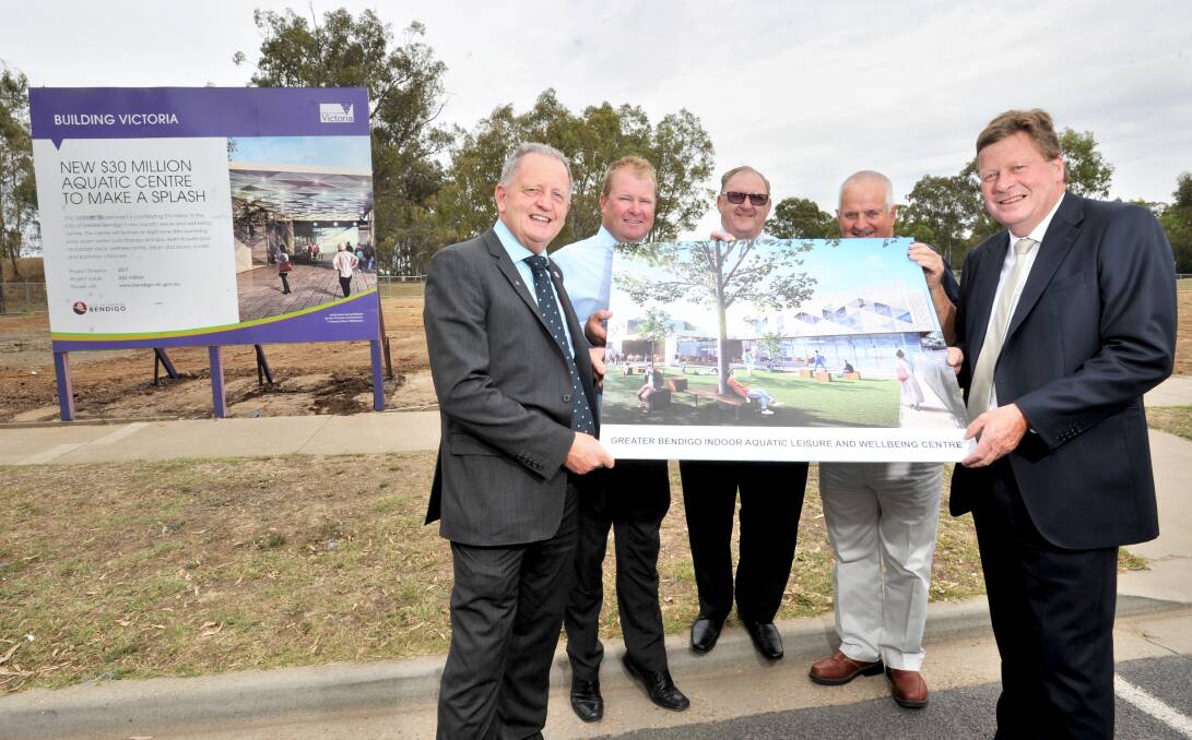 Drive: Kangaroo Flat Community Enterprise's Geoff Bowyer, Jack Lyons and Alan Besly, City of Greater Bendigo councillor Barry Lyons (centre) and senator Michael Ronaldson display plans for the new facitily. Picture: NONI HYETT