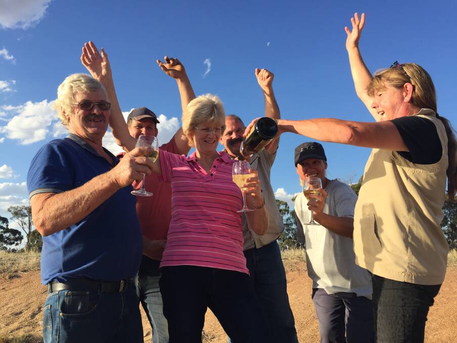 Landowners celebrate their "big win" at Max and Pauline Carter's property on Thursday. Picture: SHANE WORRELL