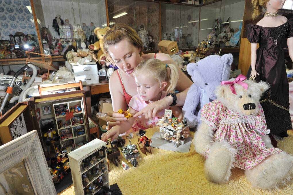 Amara Biggs and daughter Leah get a sneak peak of what will be on show at the 25th annual Doll and Teddy Show. Picture: NONI HYETT