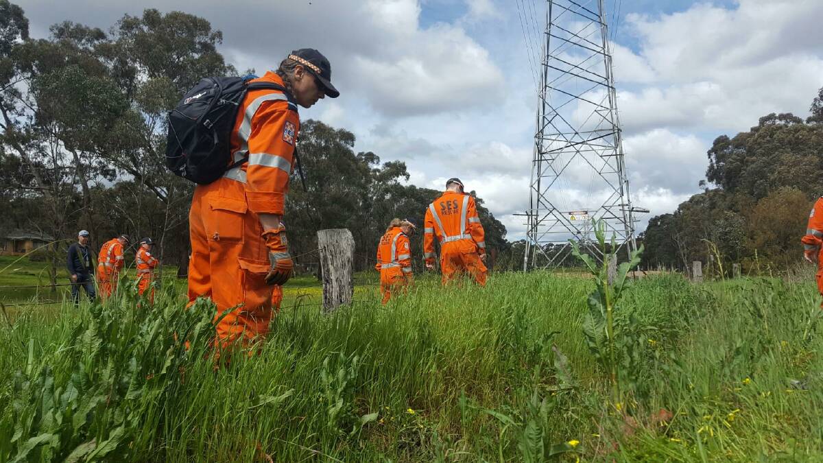 SES members search for the alleged murder weapon. Picture: JULIAN FISHER/9 NEWS