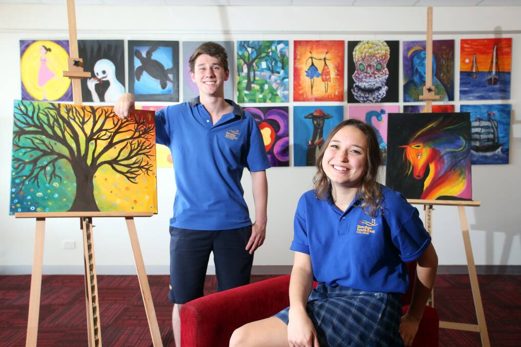 Bendigo South East College students, including Kane Watts and Tahlia McCuskey, will auction their artwork to raise money for Bendigo Health. Picture: GLENN DANIELS