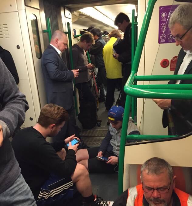 Fed up: Sitting in the aisles on overcrowded trains has become a common occurrence for Ballarat commuters following the launch of Regional Rail Link. Picture: Supplied 