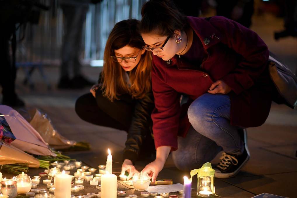 Members of the public attend a candlelit vigil, to honour the victims of Monday evening's terror attack, at Albert Square on May 23, 2017 in Manchester, England. Photo: Getty Images
