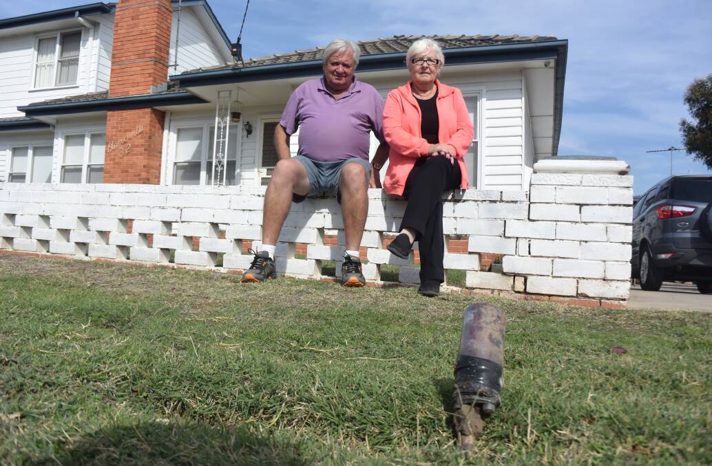 Wireless Street residents Rod and Kerri Daw with their circa-1970s landline infrastructure, held together with gaffer tape. Picture: ADAM HOLMES