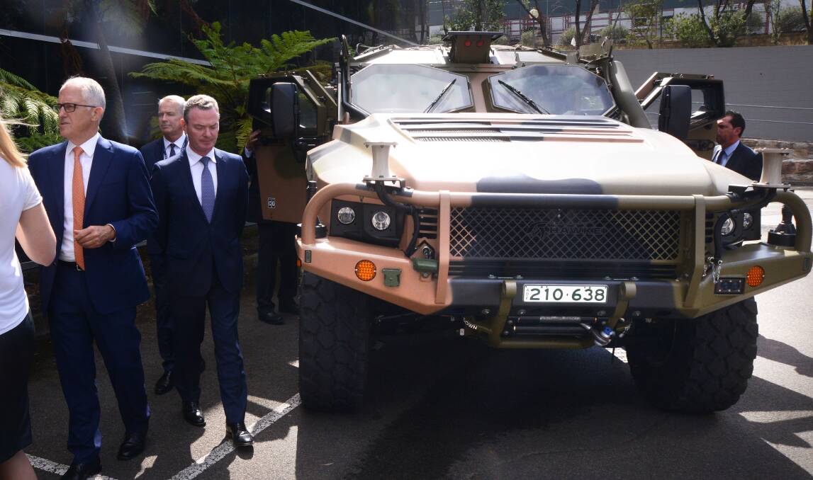 Prime Minister Malcolm Turnbull and defence industry minister Christopher Pyne with a Hawkei vehicle at Thales' Sydney facility this week.