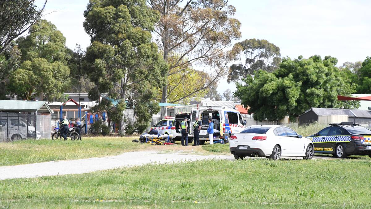 Police remove the dirt bike from the scene on Lockwood Road in Kangaroo Flat. Picture: Adam Holmes