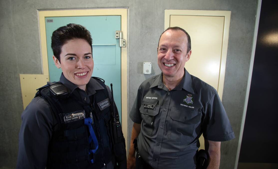Police custody officers Erin Williams and Conrad Foskett at the cells in the Bendigo police station. Picture: GLENN DANIELS