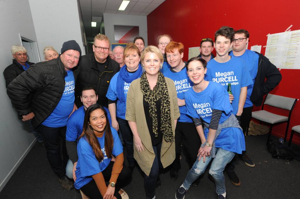 Megan Purcell with supporters at her electoral office on Saturday night. Picture: NONI HYETT