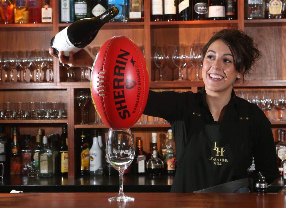 A football blocks Wine Bank on View front of house staff member Bianca Bell from pouring a glass. Picture: PETER WEAVING