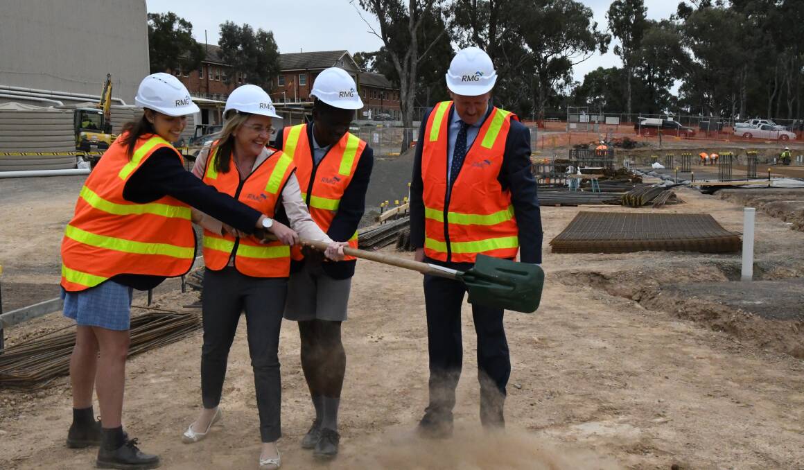 Members for Bendigo East Jacinta Allan "turns the first sod" with school captains Meg Patterson and Yohannes Basha, and principal Brian Turner. Picture: Adam Holmes