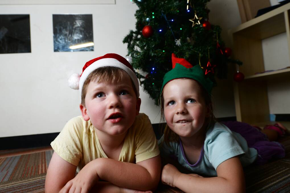 Riley and Paige, 3, at Jenny's Early Learning Centre in Strathfieldsaye, get ready for the Christmas carols across the region during the next two weekends. Picture: DARREN HOWE