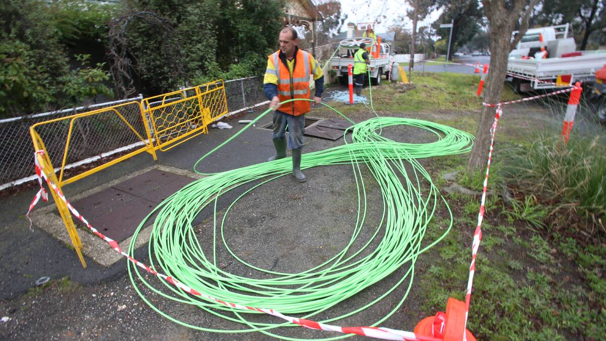 Workers lay cables at the start of the NBN rollout in Bendigo in 2013. Only a few suburbs are left to be connected.