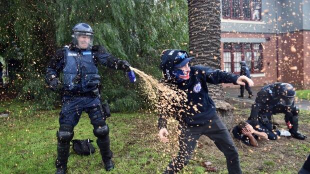 Police use capsicum spray at clashes in Coburg. Picture: Julian Smith