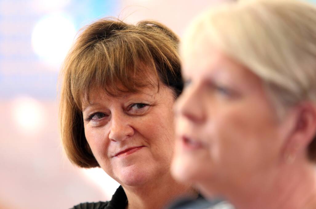 Bendigo Kangan Institute's Donna Rogers listens as Maree Edwards explains the government's funding commitment. Picture: GLENN DANIELS