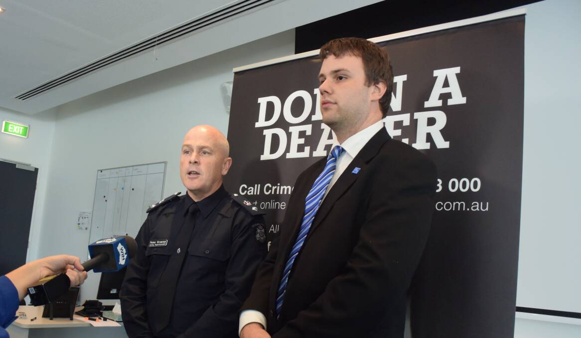 Acting Superintendent Peter Greaney and Chris Plumridge, of Crime Stoppers, at the launch of Dob in a Dealer in Bendigo on Friday. Picture: ADAM HOLMES