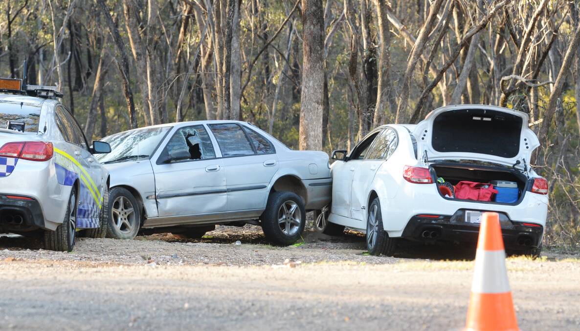 The unmarked police car (right) was rammed at Crusoe Reservoir in September. It was involved in a second crash in front of the Bendigo police station on Wednesday, with the same driver, Sergeant Mick McCrann.