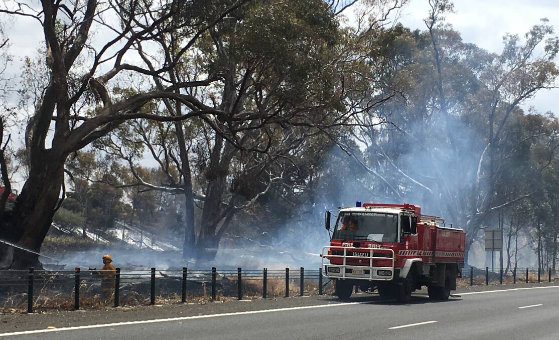 A CFA tanker parked on the edge of the Calder Highway during a fire in Ravenswood South last month.