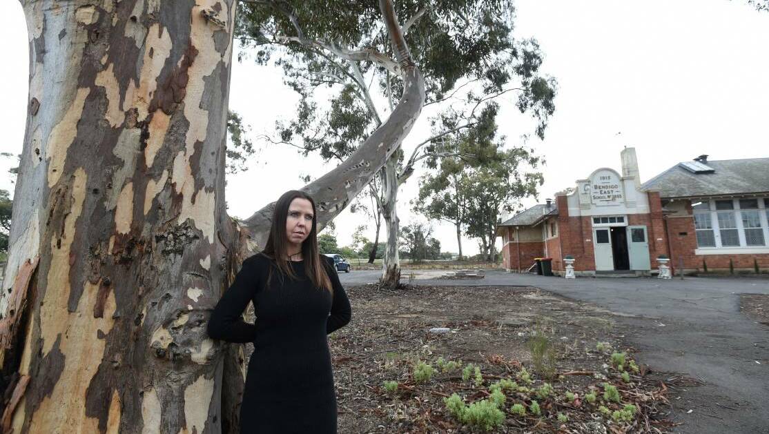 Gemma Starr with one of the trees from the Avenue of Honour at the former East Bendigo State School. Picture: JODIE WIEGARD