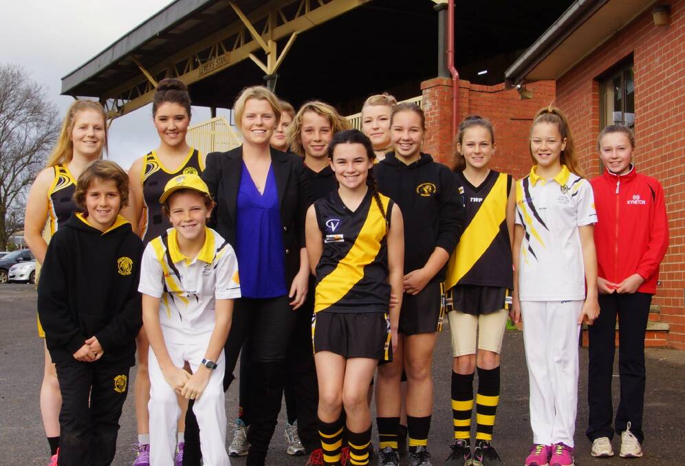 Liberal candidate for Bendigo Megan Purcell with players from a range of Kyneton sporting clubs at today's announcement.