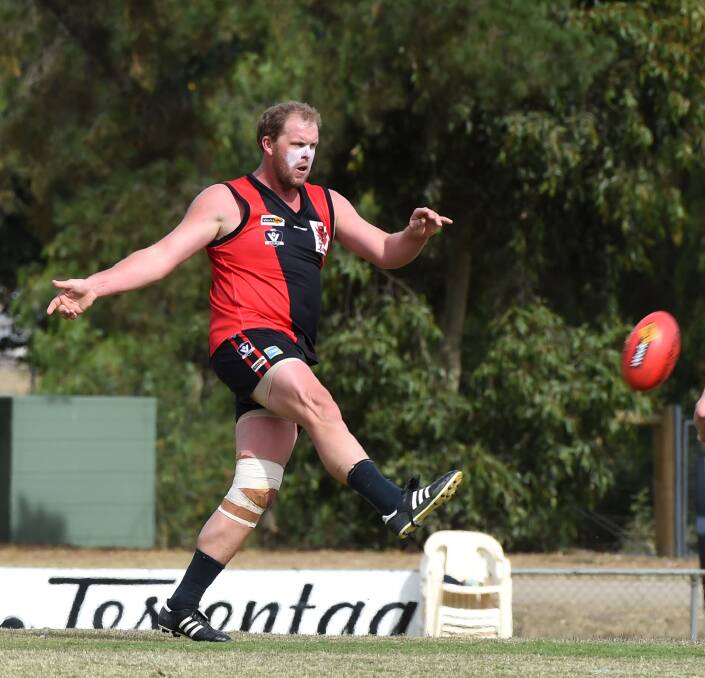 KICKING ON: Ruckman-forward Matt Sawyer in action for White Hills on the Demons' turf at Tint-a-Car Oval. The 200-game player is a triple winner of the senior club champion award. Picture: PETER WEAVING 