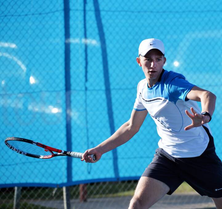 HOT FORM: Spring Gully's Isaac Watson winds up to strike a forehand winner in his 18-and-under boys singles clash. Pictures: BRENDAN McCARTHY