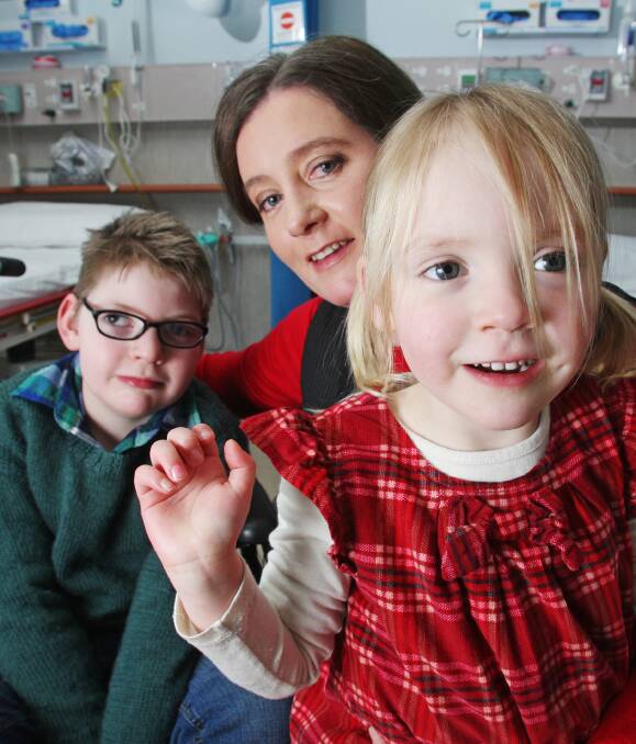 RETURNING: Emma Buckland with children Alex, 8, and Hayley, 4 at St John of God Hospital. Picture: DARREN HOWE