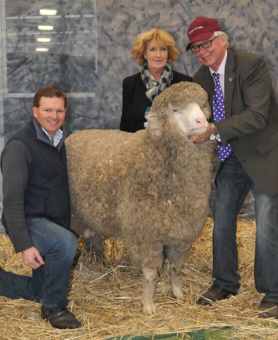 GOAL: Pat Millear, Stud Park South, with vendors Graham and Susan Coddington, Coddington Uardry stud, Yeoval, NSW and last year's top priced, $30,000 ram. 