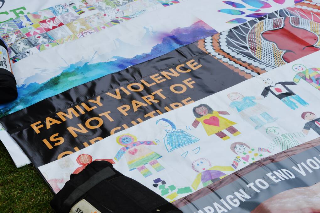 ANTI VIOLENCE: A banner from last year's White Ribbon Day march. Between 700 and 800 Bendigonians walked against family violence. Picture: DARREN HOWE