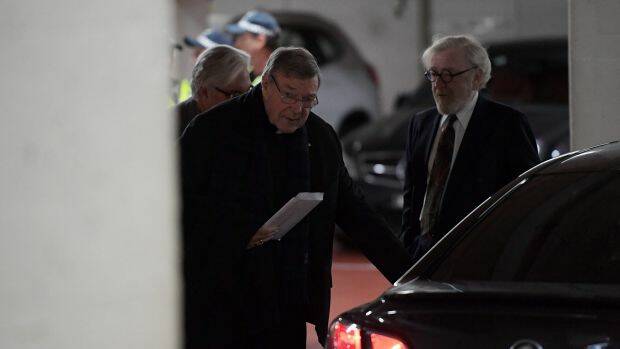 Cardinal George Pell leaves the car park of his lawyer's offices. Photo TRACEY NEARMY