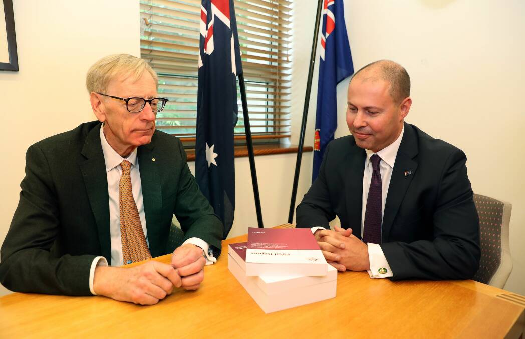 Commissioner Kenneth Hayne and Treasurer Josh Frydenberg with the final report from the Royal Commission into Misconduct in the Banking, Superannuation and Financial Services Industry. Picture: KYM SMITH, AAP Image / Fairfax Media Media Pool