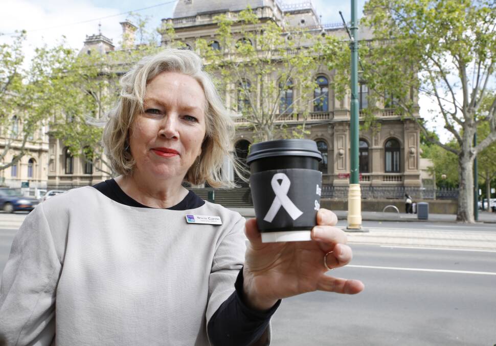 Women's Health Loddon Mallee executive officer Tricia Currie shows her support for White Ribbon Day with a cup of coffee. Picture: EMMA D'AGOSTINO