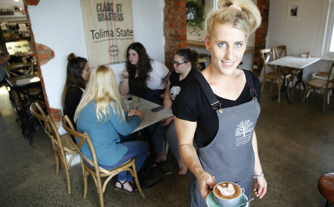 SERVICE WITH A SMILE: Gemma Martin is part of the team at the Spring Gully General Store, which won the state Golden Plate award for best customer service. Picture: EMMA D'AGOSTINO