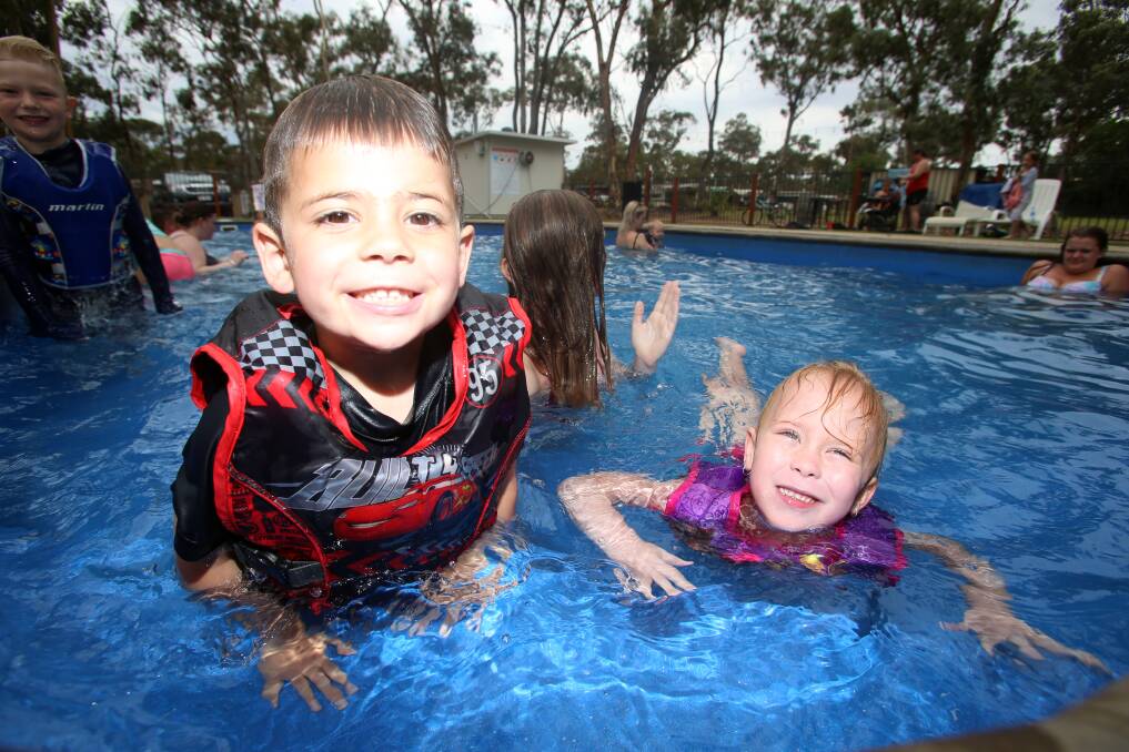 Shylla Sweet and Jaden Bell in the swimming pool at Lake Eppalock Holiday Park. Picture: GLENN DANIELS