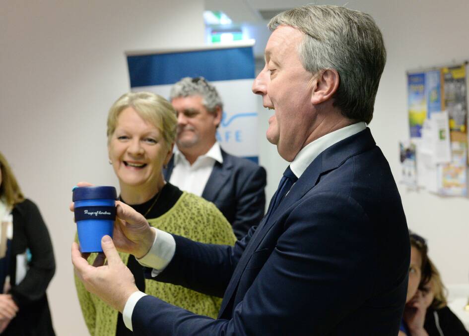 Minister For Housing, Disability and Ageing, Martin Foley, with a Haven; Home, Safe Cup of Kindness. The branded Keep Cup was last week launched as a fundraiser for programs supporting people experiencing homelessness. Picture: DARREN HOWE