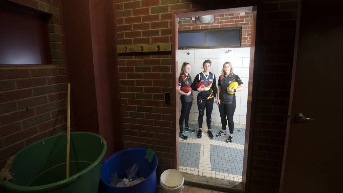 CRAMPED STYLE: Bendigo Thunder players Emily Findlay, Emma Grant and Hayley Trevean in their shared rooms. Picture: DARREN HOWE